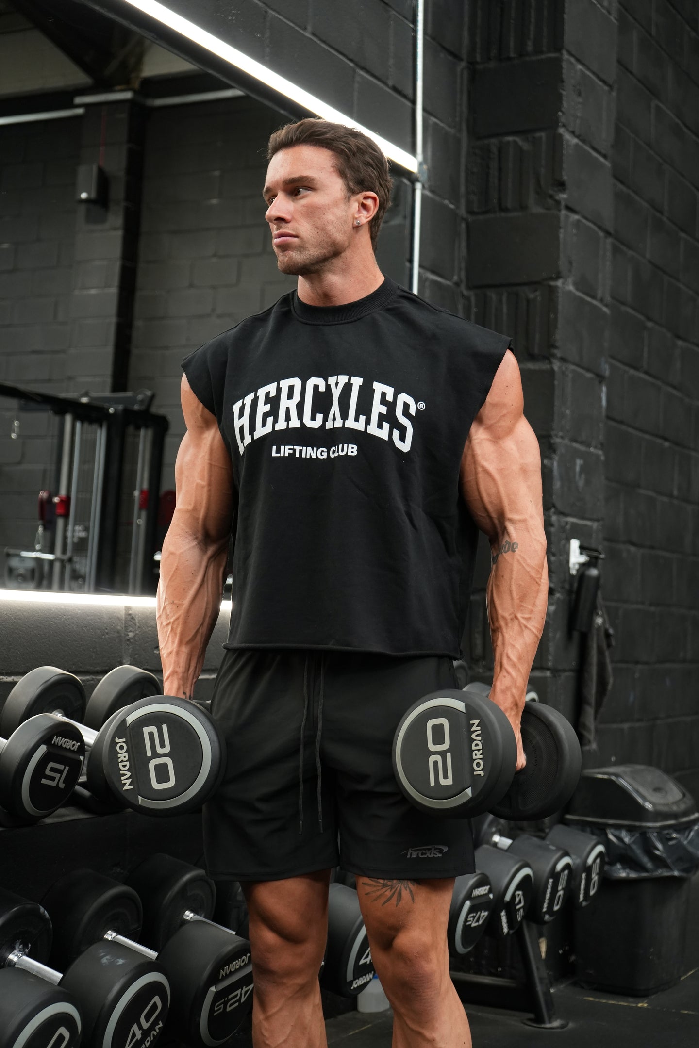HERCXLES Lifting Club Boxy Cut Off - Black model holding dumbbells