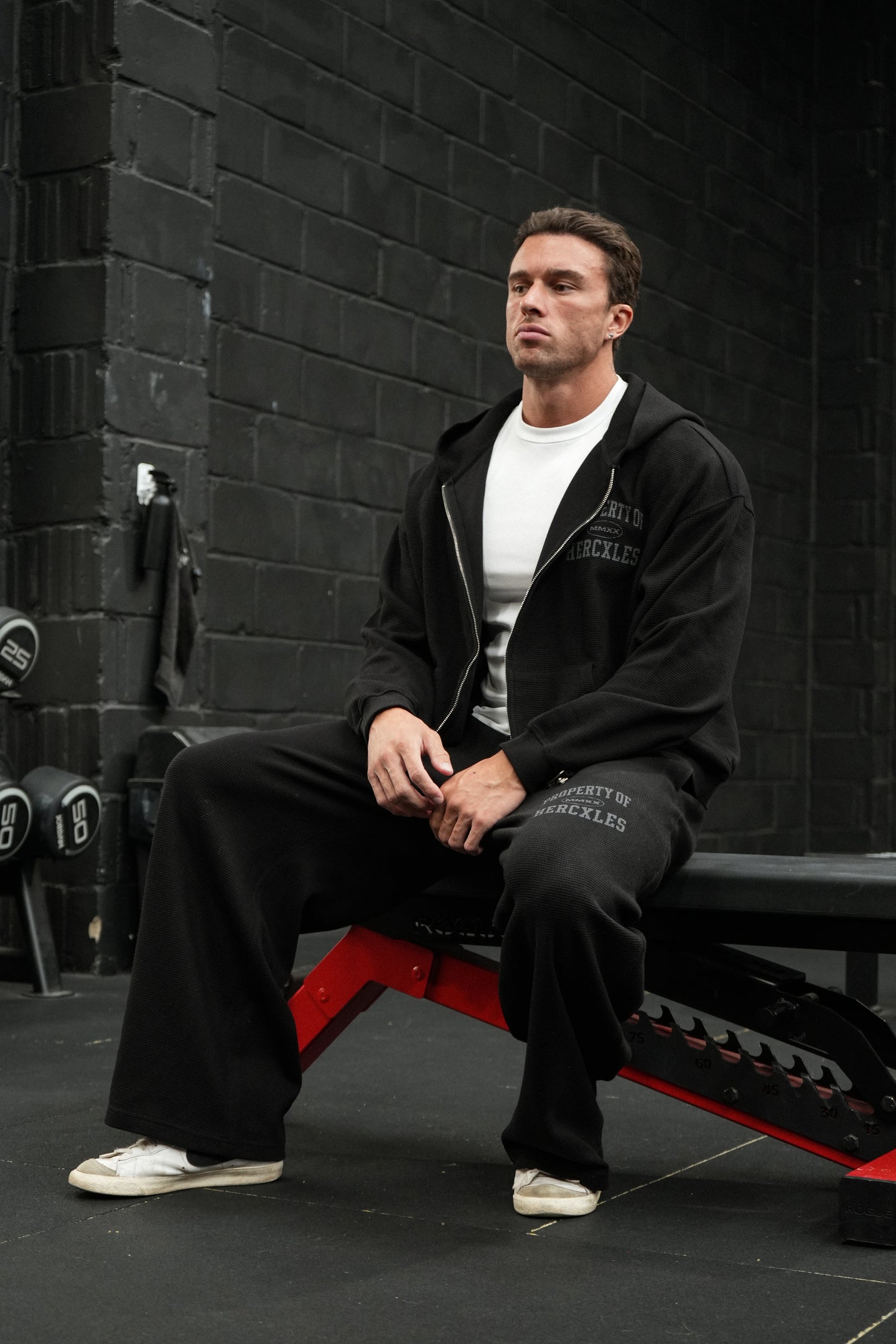 HERCXLES Property Of Waffle Boxy Zip Hoodie - Black seated model full set