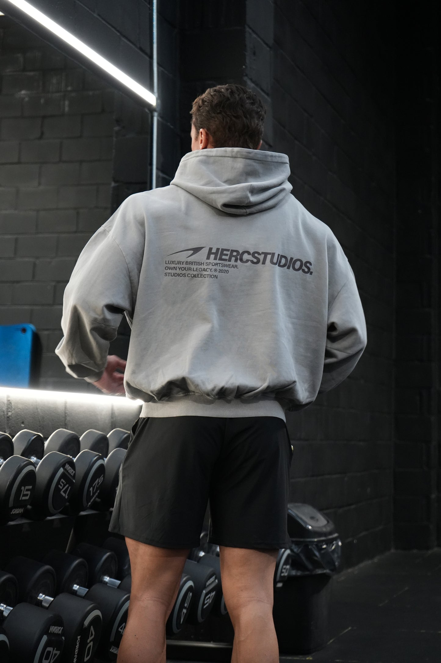 HERCSTUDIOS Boxy Hoodie model fit reference in Light Grey - back view