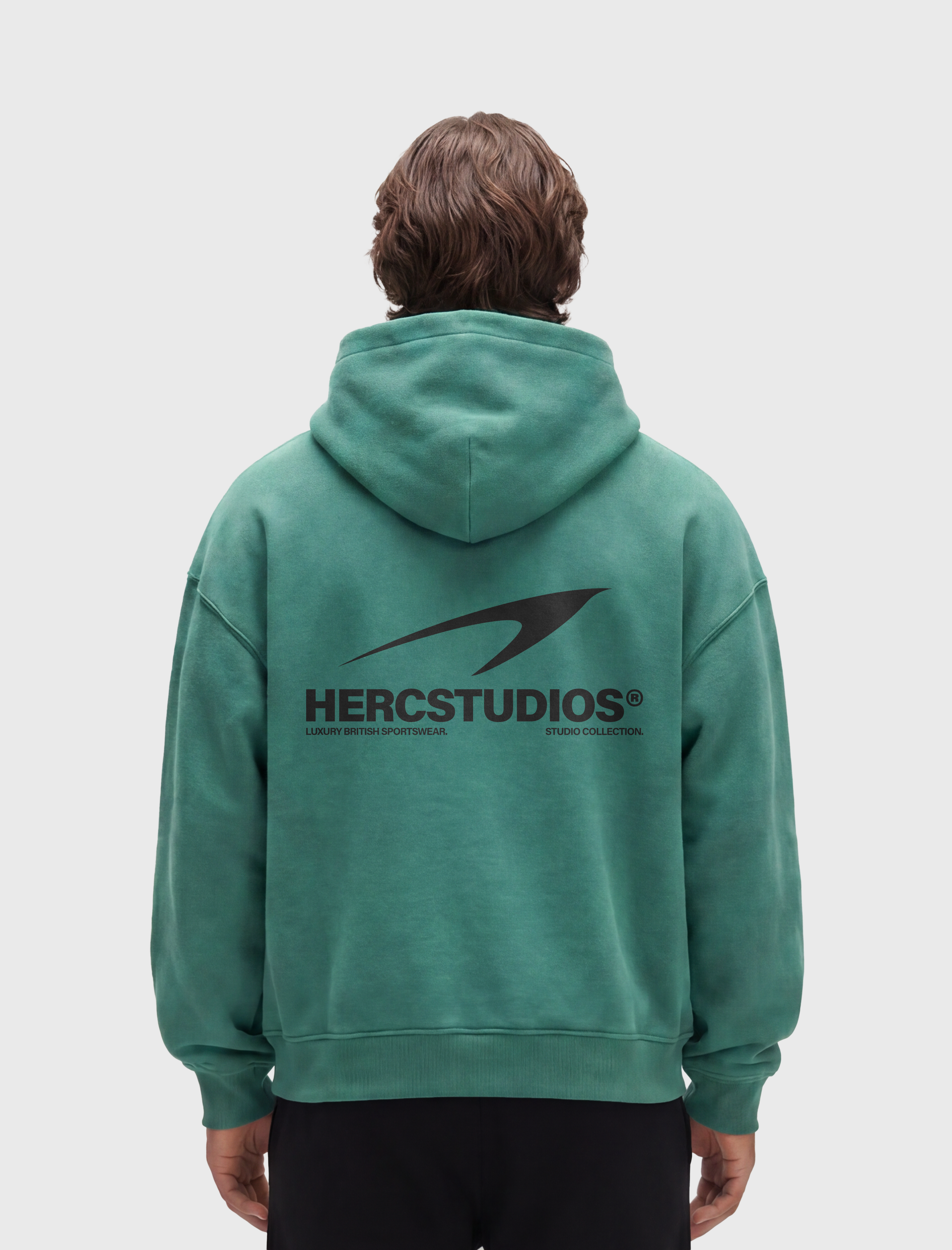 HERCSTUDIOS Hoodie - Medium Green model back