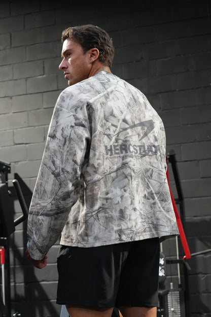 HERCSTUDIOS CAMO LONG SLEEVE - Tree Camo model back view showing the back graphic