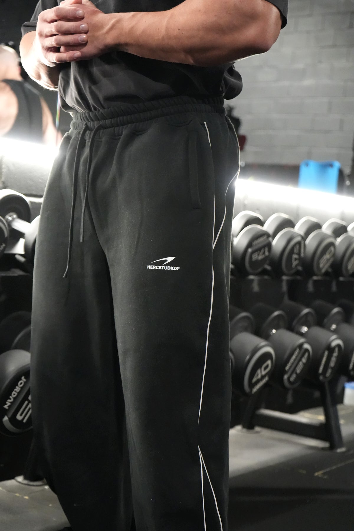 HERCSTUDIOS Reflective Sweatpants - Black logo and piping detail photo