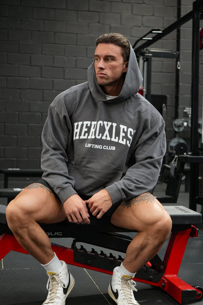 HERCXLES Lifting Club Vintage Wash Boxy Hoodie - Dark Grey seated model front