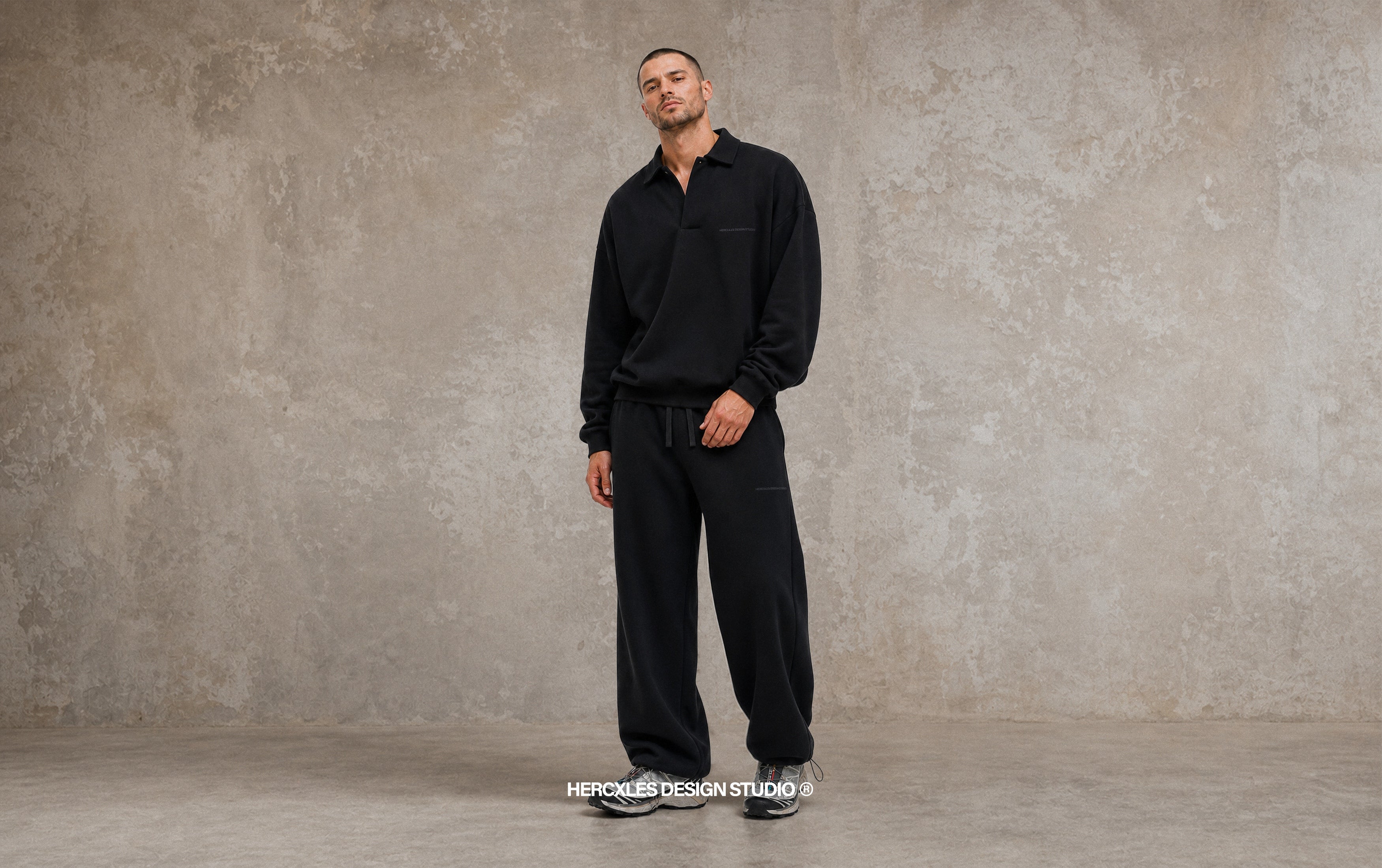 HERCXLES Design Studio campaign model in black sweatsuit